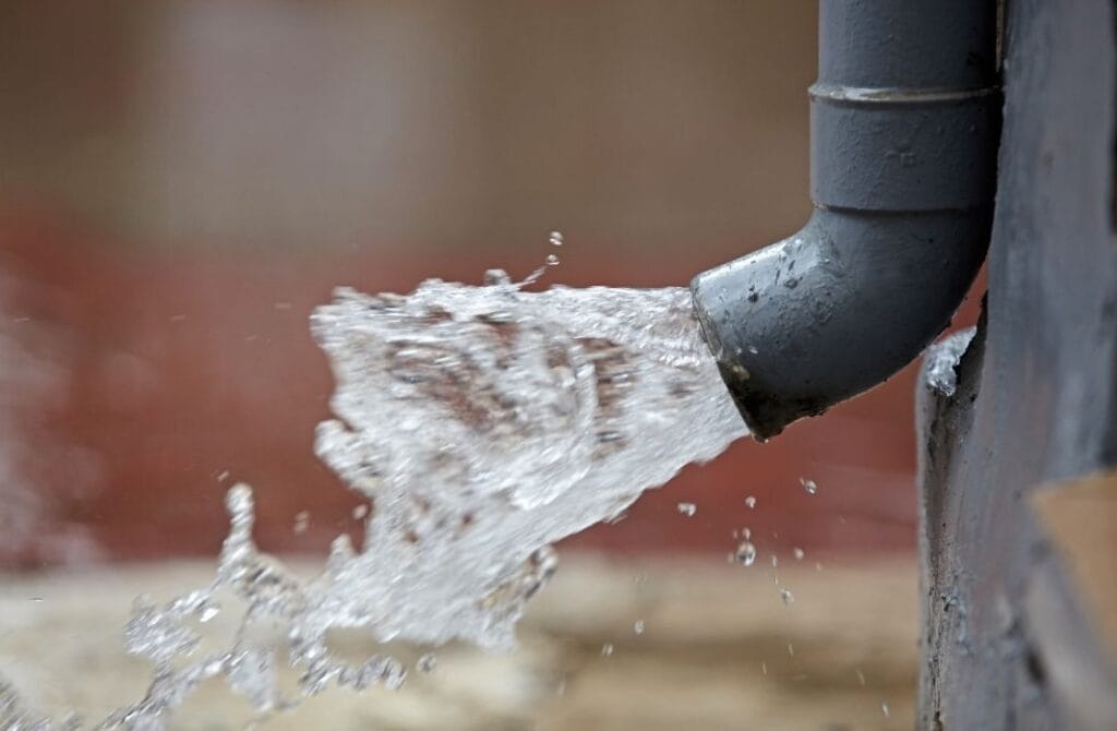 gutter with water coming out of it